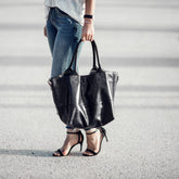 Paris Smooth leather black tote handheld by woman on street