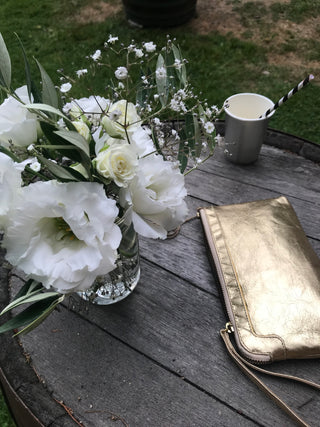 Gold Berlin on rustic wood table with 