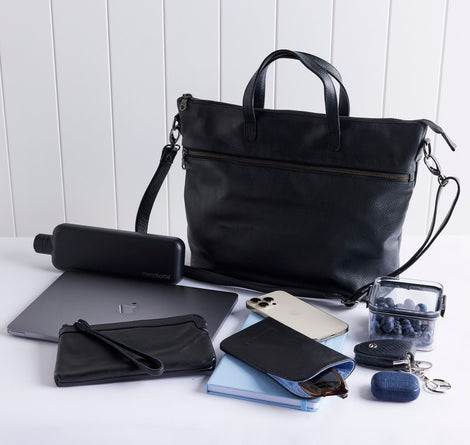 Rome leather tote with items in front to show what fits inside.