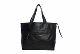 Black leather tote bag on a white background