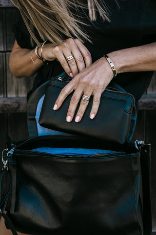 Black pebbled leather Berlin Clutch wallet women placing inside Singapore Crossbody bag